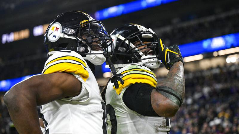 Pittsburgh Steelers running back Najee Harris, right, celebrates a touchdown with wide receiver...