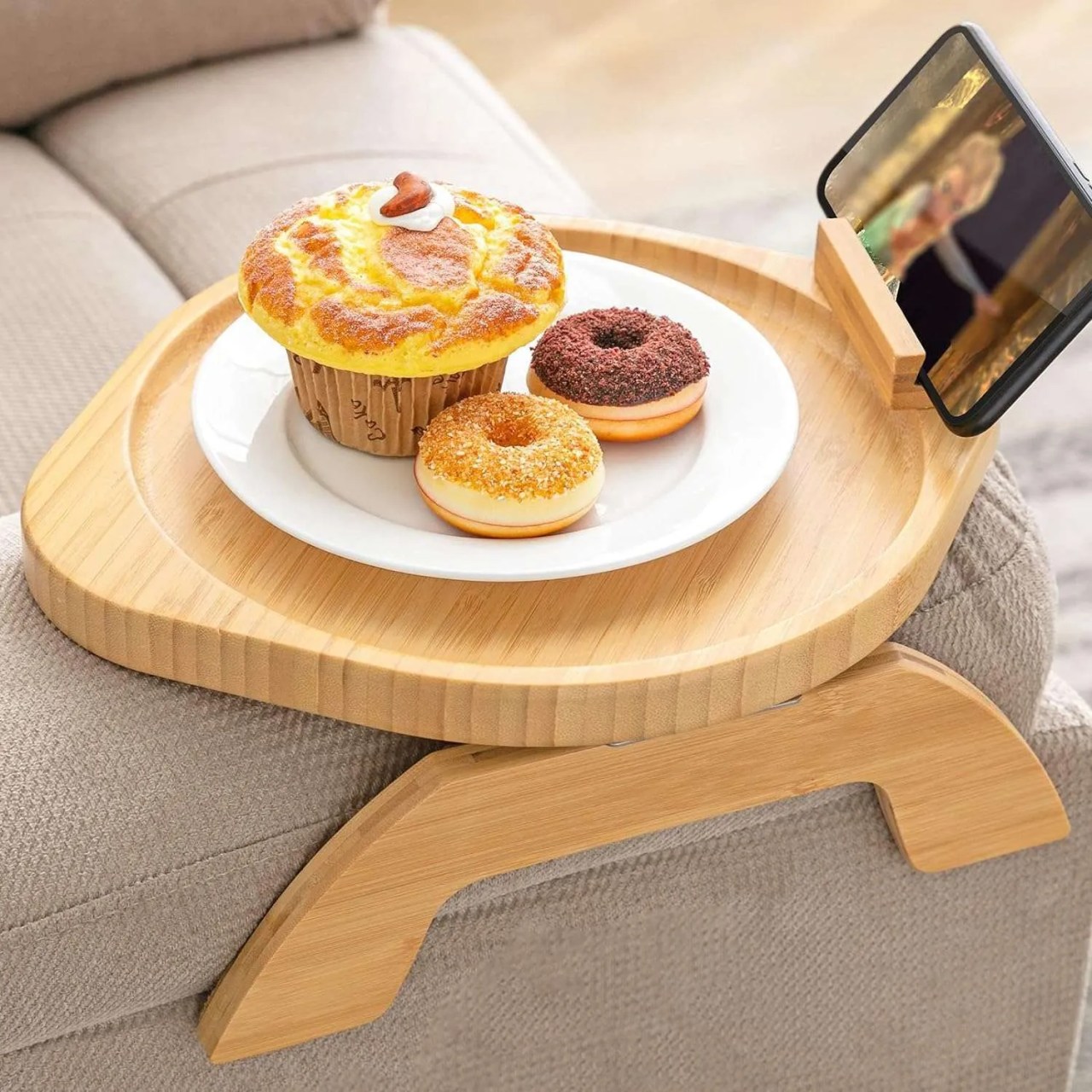 a bamboo tray on the edge of a sofa