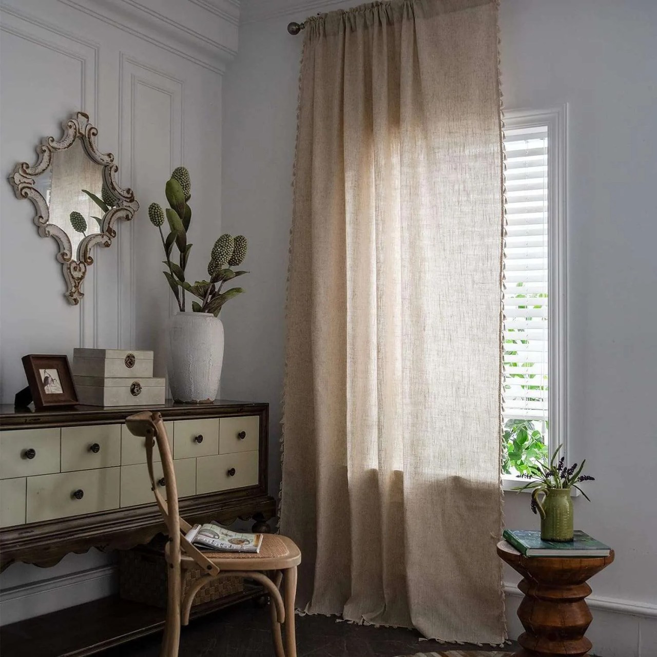 a hemp and linen curtain with tassels in a dining room