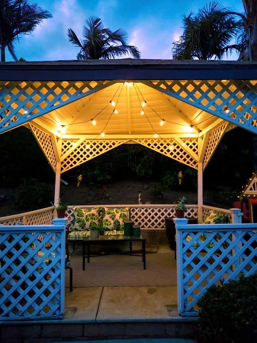 a gazebo with solar powered lights hanging on the roof