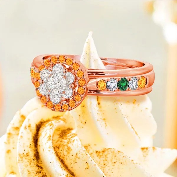 a rose gold with diamonds and emerald ring