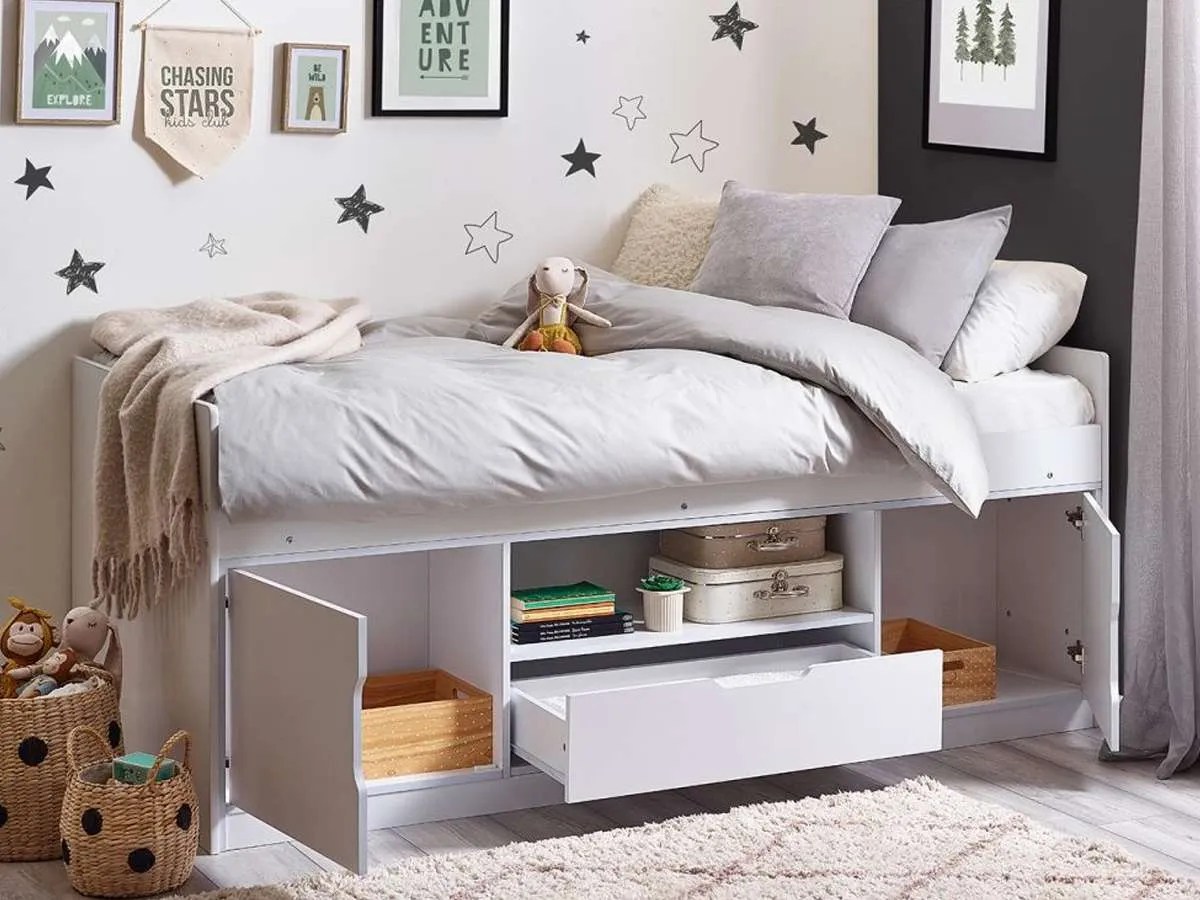 a cabin bed in a kids room with star wallpaper