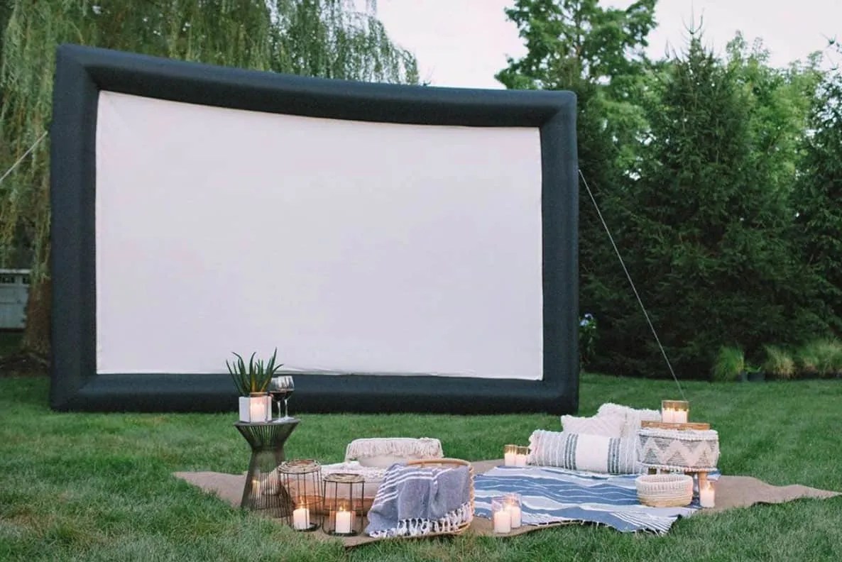 an inflatable movie screen in the garden