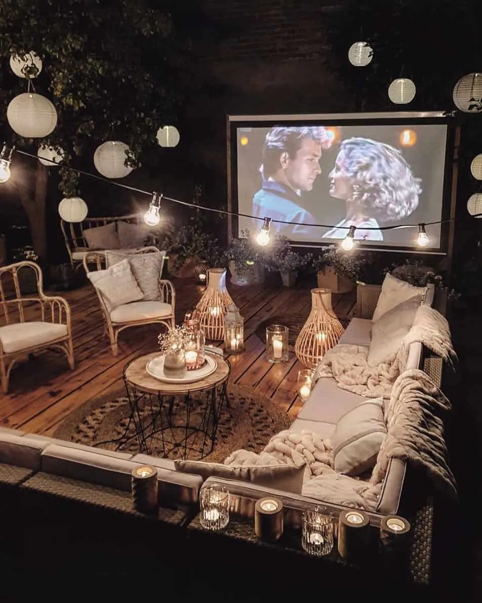 a cosy garden cinema setup with dirty dancing playing on a movie screen