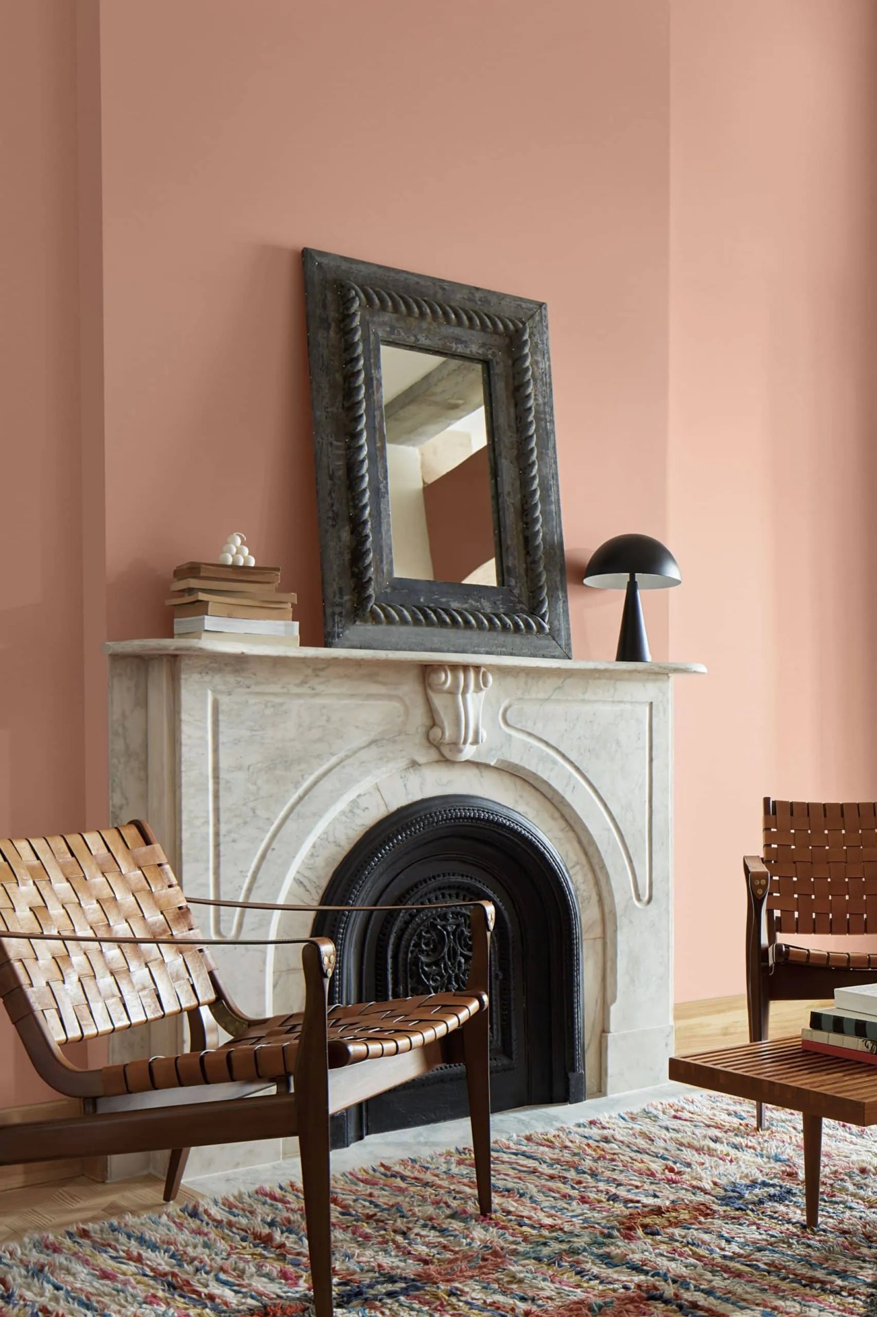 Benjamin Moore Conch Shell on the walls in the living room with a marble fireplace