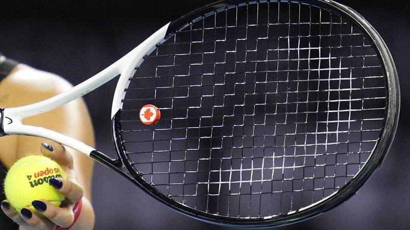 Canada's Bianca Andreescu's tennis racquet has a vibration damper with the Canadian flag on it...