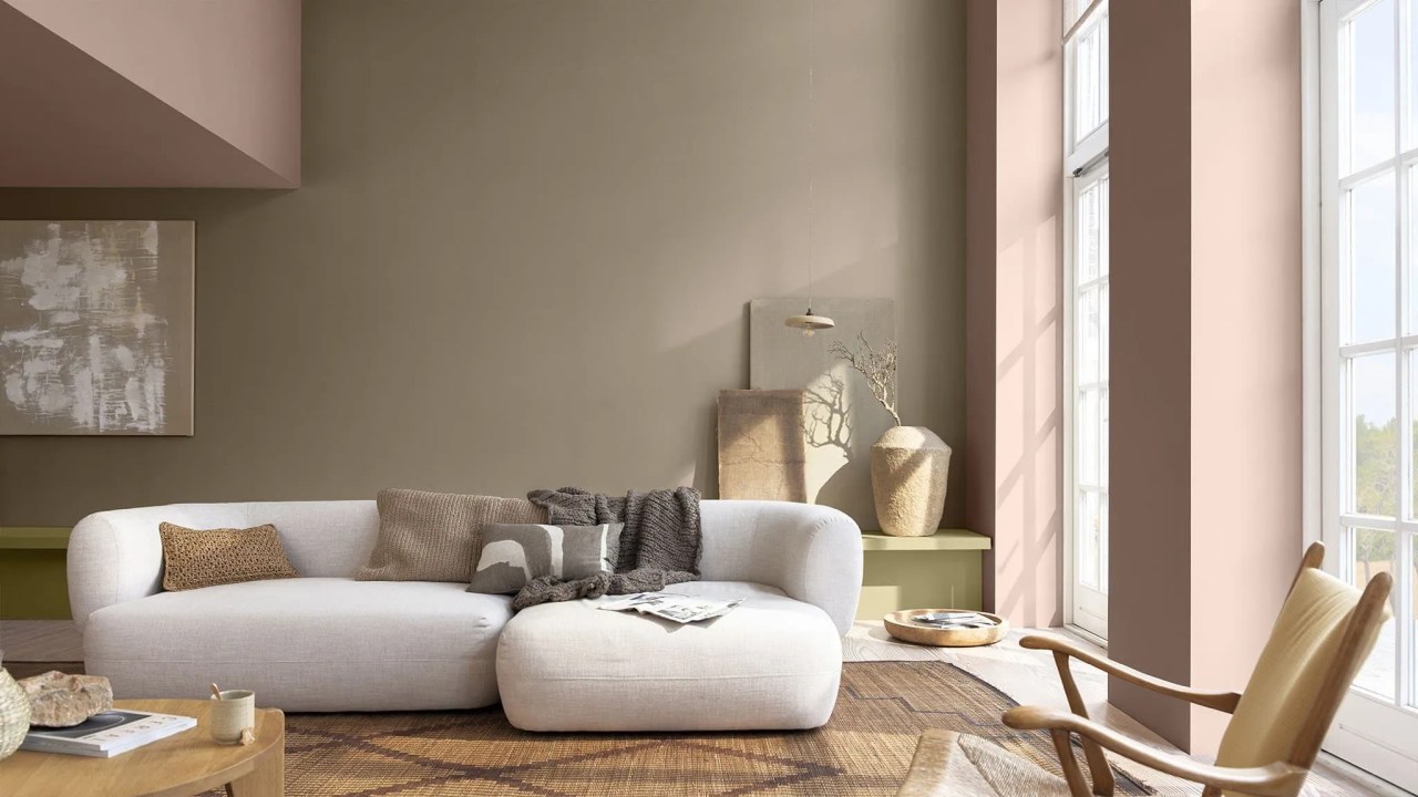 natural tones used in the living room with a curved sofa