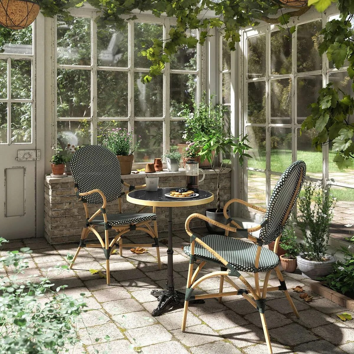 bistro style seating with wrought iron table in a conservatory
