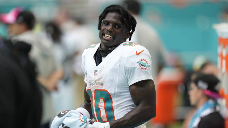 Miami Dolphins wide receiver Tyreek Hill (10) rests on the sidelines during the second half of...