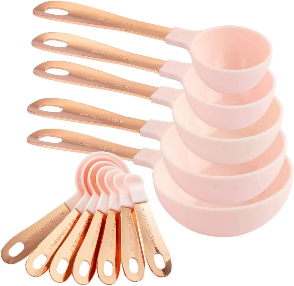 Pink measuring spoons with copper handles