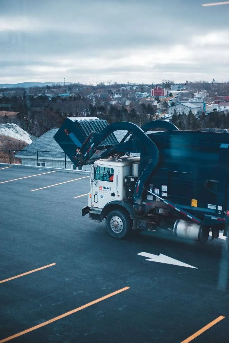 garbage truck emptying waste bin