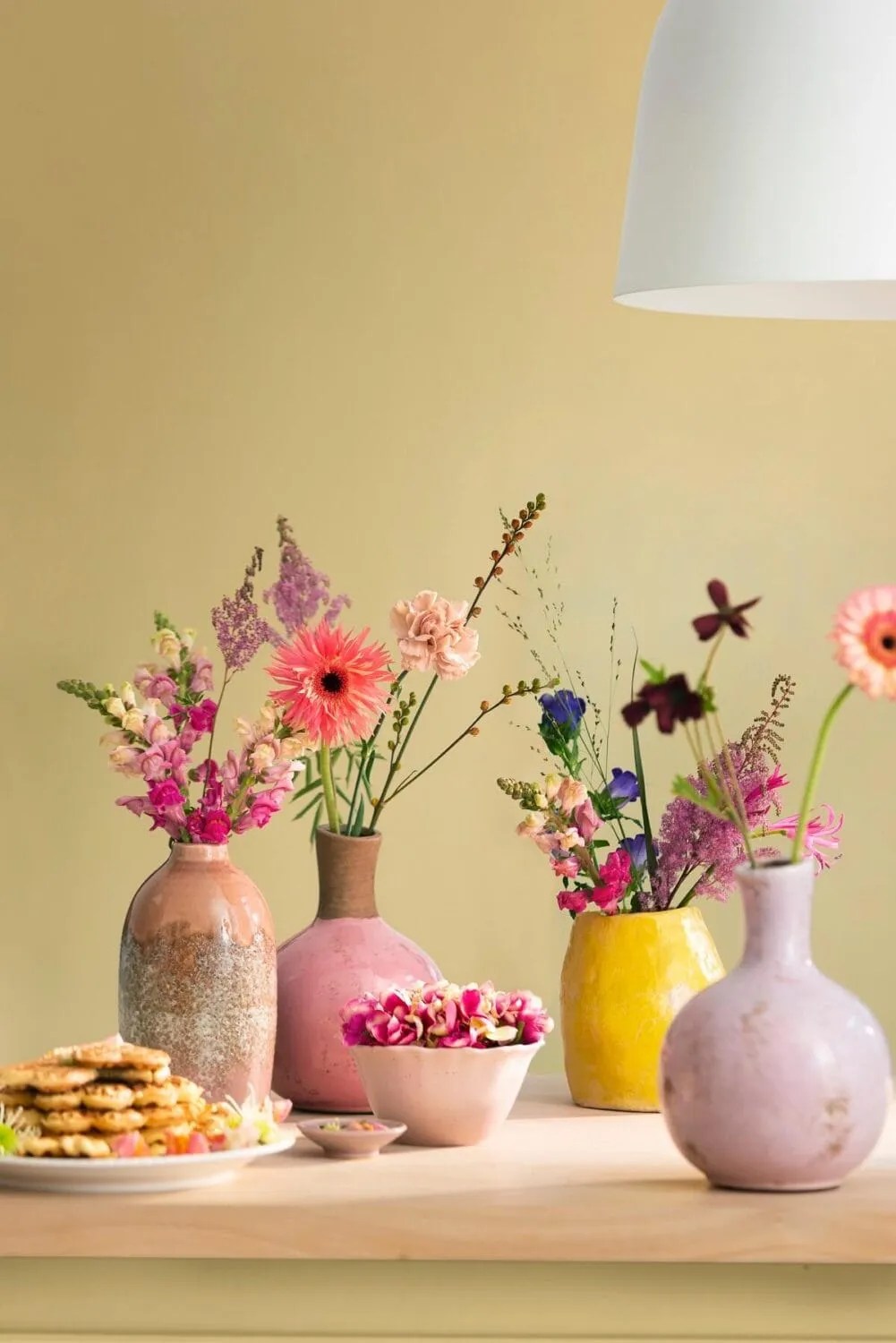 Dulux Wild Wonder on the walls with flowers in vases